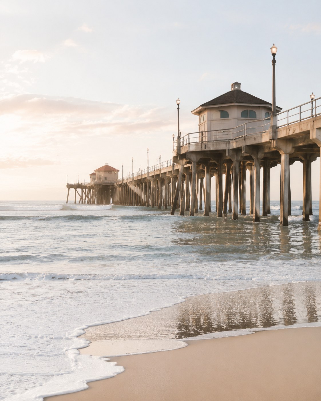 Huntington Beach pier at sunset with gentle surf